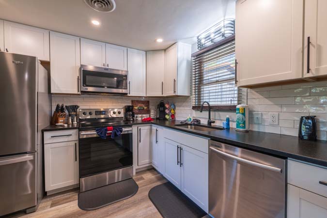 Game room with shuffleboard at Onyx Outpost