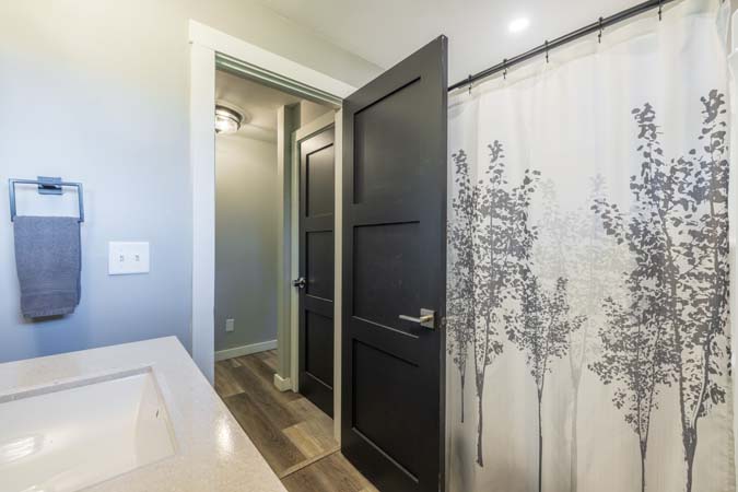 Cornhole game setup outside Onyx Outpost