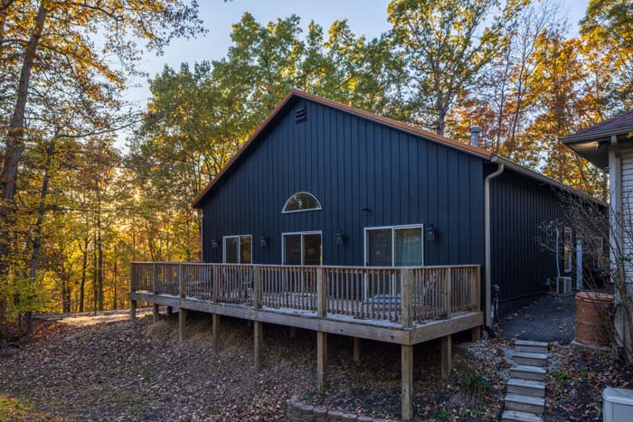 Rear exterior of Peach Tree Lodge with elevated wraparound deck