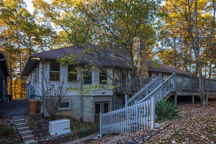 Lower-level exterior and deck stairs at Peach Tree Lodge