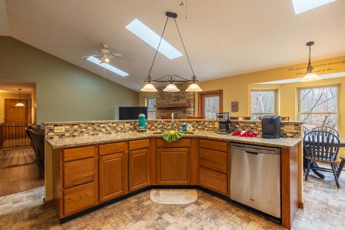 Fully equipped kitchen with wood cabinets and dishwasher