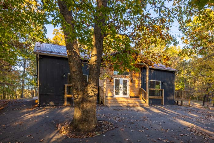 Peach Tree Lodge exterior framed by a large oak tree