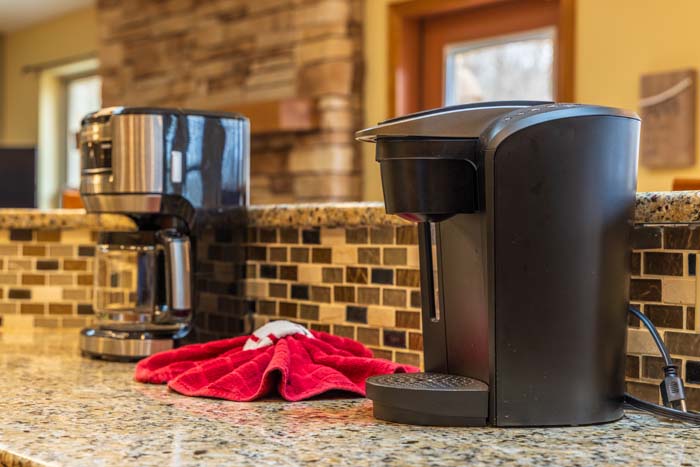 Coffee station with drip and single-serve makers at Peach Tree Lodge