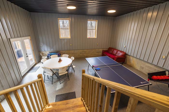 Game room with ping-pong table and walkout at Peach Tree Lodge