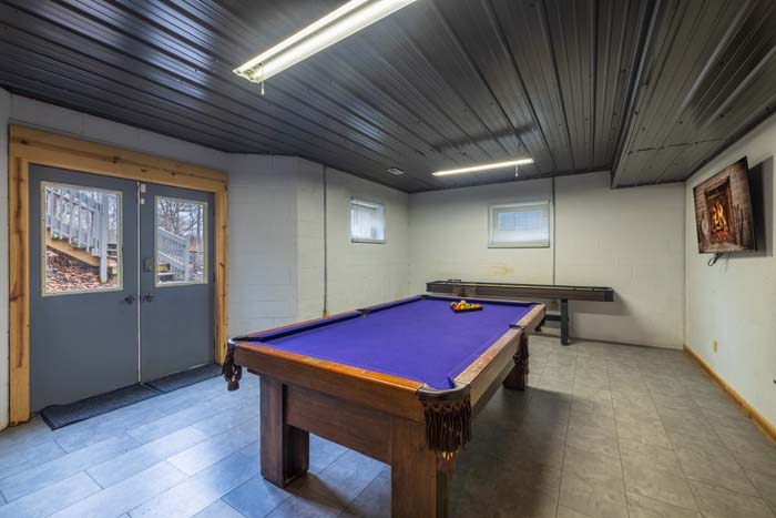Game room with pool table and walkout doors