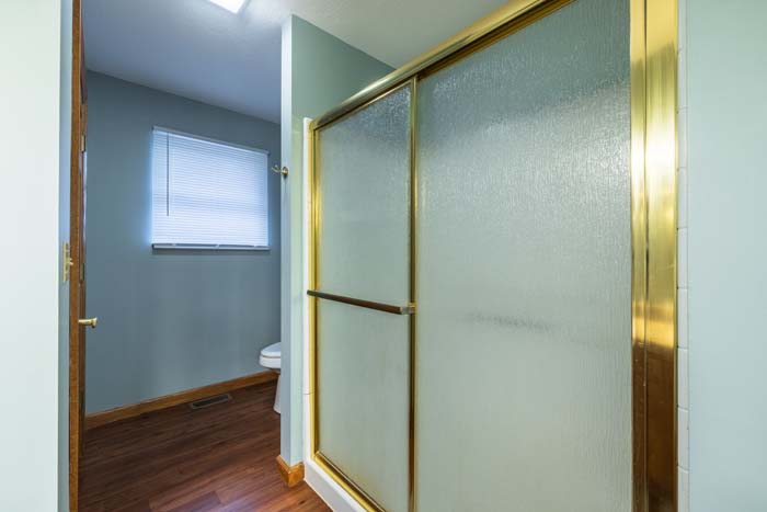 Bathroom with sliding glass shower door