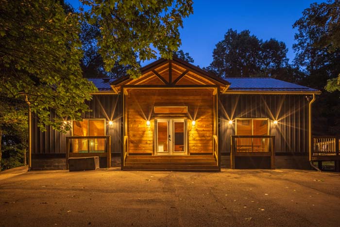 Front of Peach Tree Lodge glowing at twilight