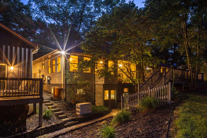 Landscaped exterior with warm lighting at dusk