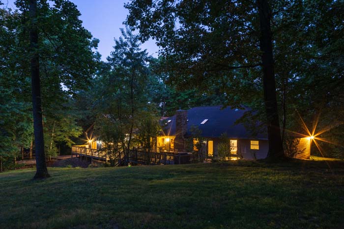 Peach Tree Lodge exterior from the lawn at twilight