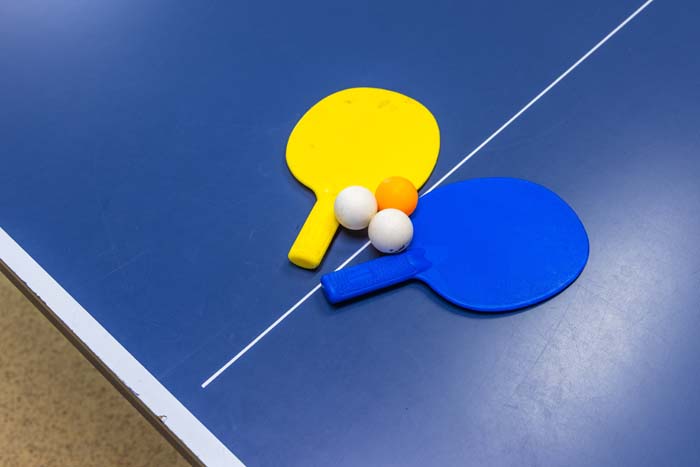 Ping-pong paddles and balls on the table