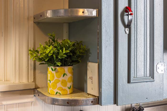Lemon-print planter on a corner shelf