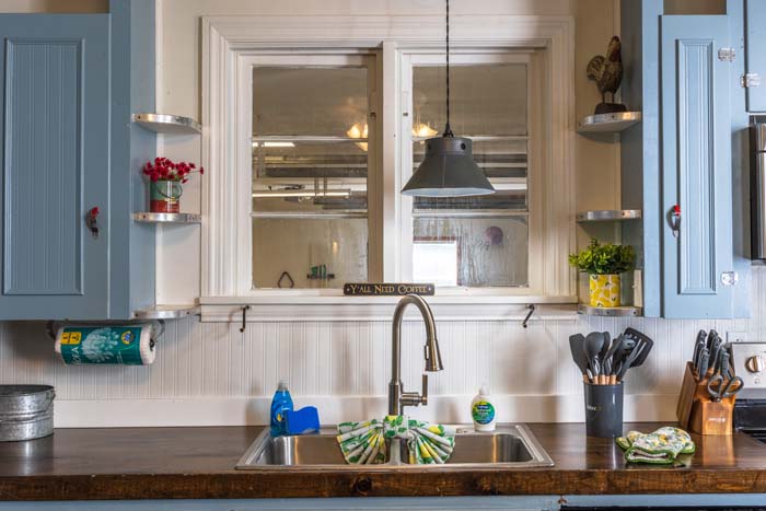 Kitchen window over the sink with pendant light