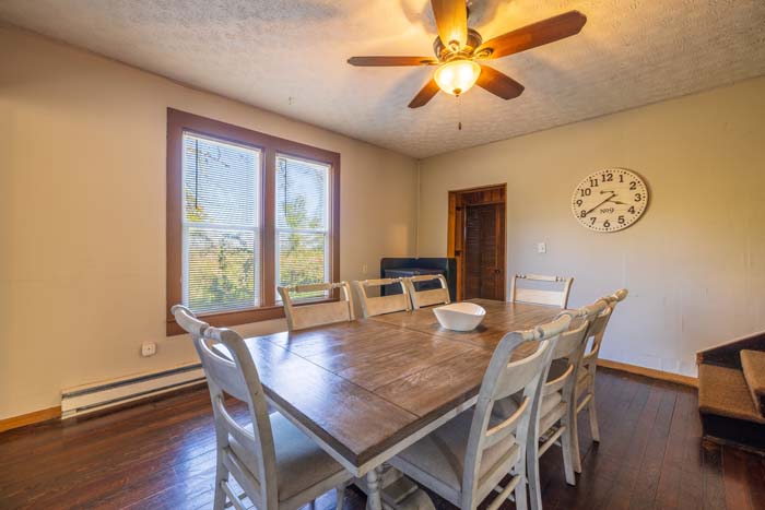 Dining room with table for six and ceiling fan