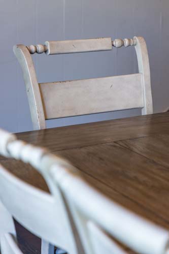 Farmhouse dining chair and wood table detail