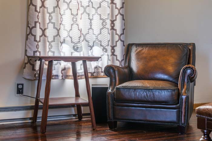 Leather club chair by the window