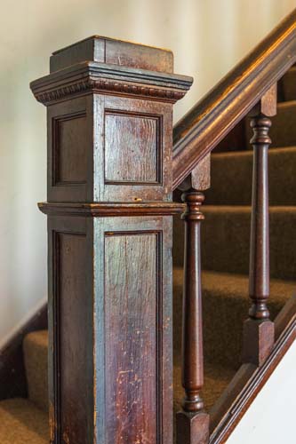 Carved newel post on the staircase