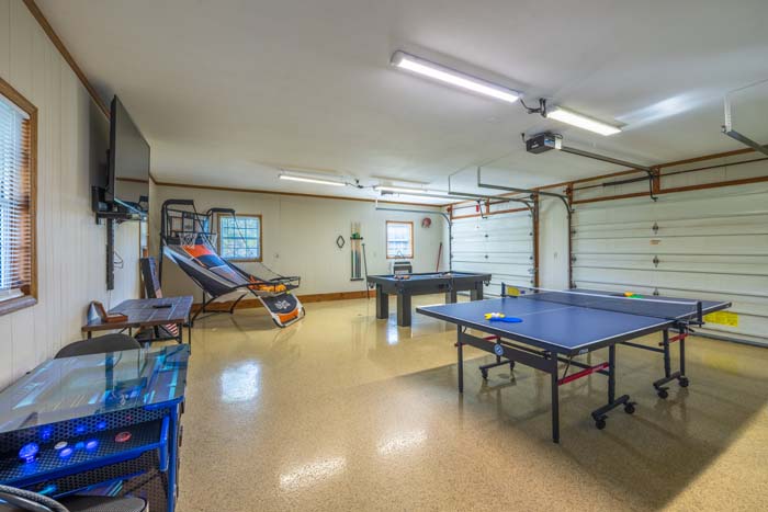 Game room with ping-pong and pool tables at Ruby's Farmhouse