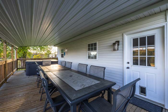 Covered deck with dining table for a large group
