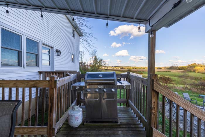 Covered deck with gas grill and hot tub