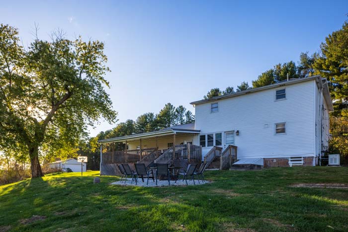 Rear exterior with deck and patio seating