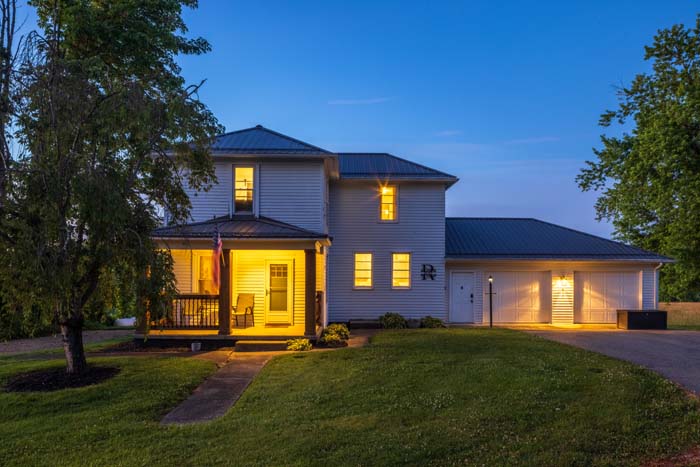 Front exterior at twilight with lit windows