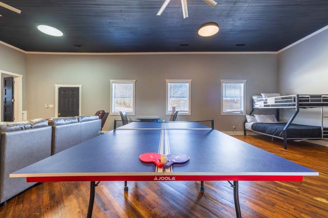 Bedroom with large TV at The Grange