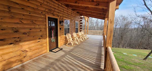 front covered deck on log cabin