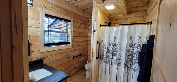 bathroom with white shower curtain