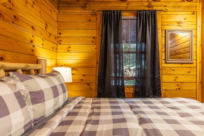 Bedroom with forest view windows