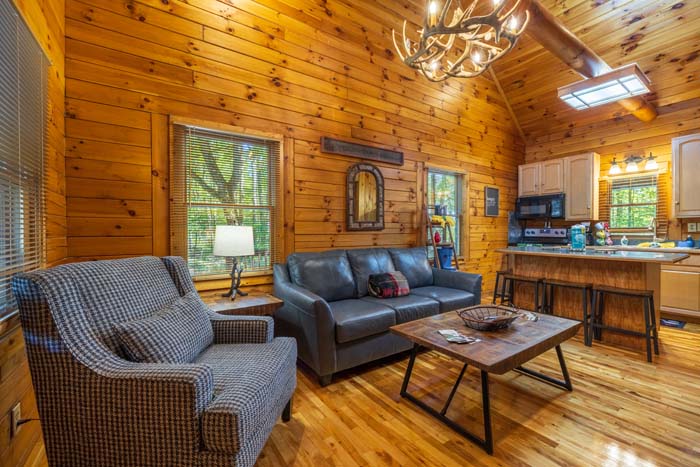 Open concept cabin interior with kitchen and dining area