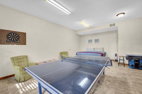 game room with ping pong table and bunk beds