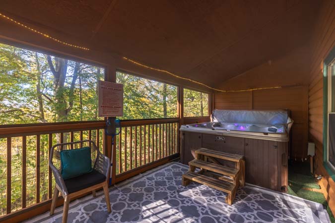 Elevated screened porch view at Bluebird Cabin