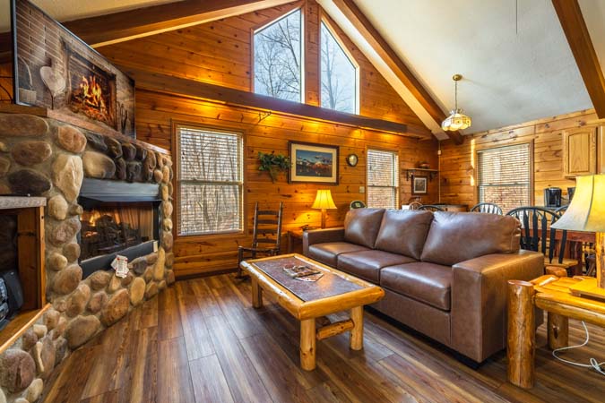 Hot tub on screened porch at Bluebird Cabin