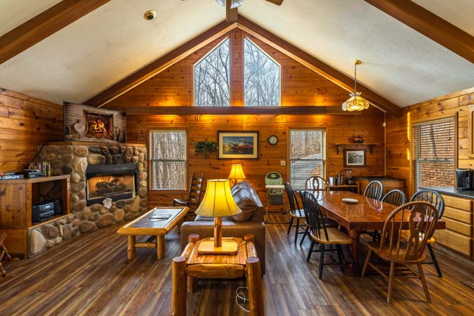 Multiple decks surrounded by trees at Bluebird Cabin