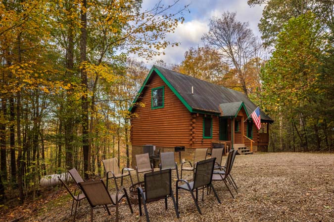 Great room with floor to ceiling fireplace at Catbird Cabin