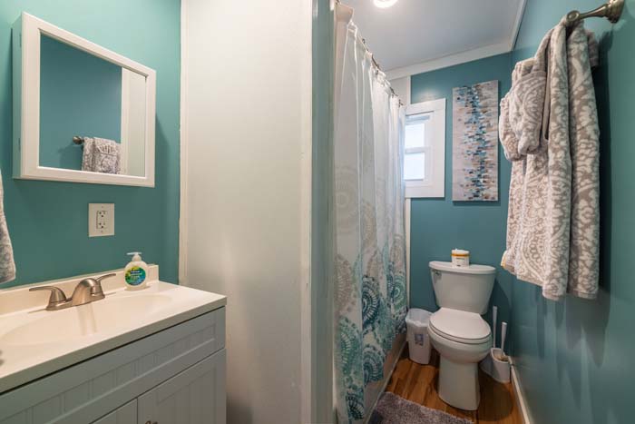 Porch view overlooking fenced backyard