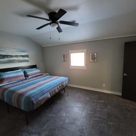 bedroom with ceiling fan, tile floor