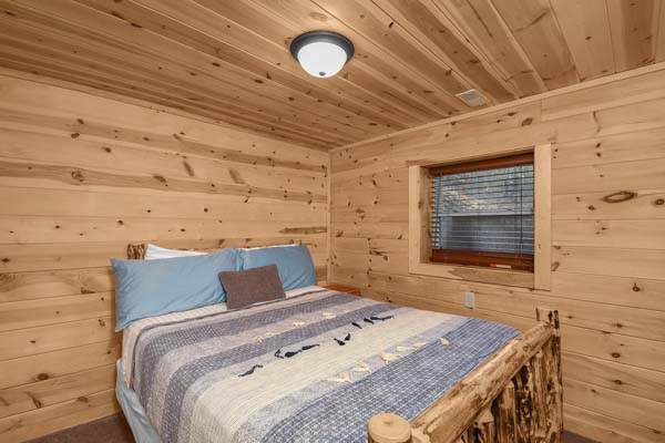 Cozy cabin bedroom with rustic charm