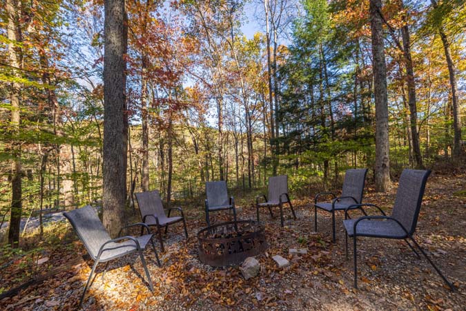 Living room with wood burning fireplace at Little Pine Cabin