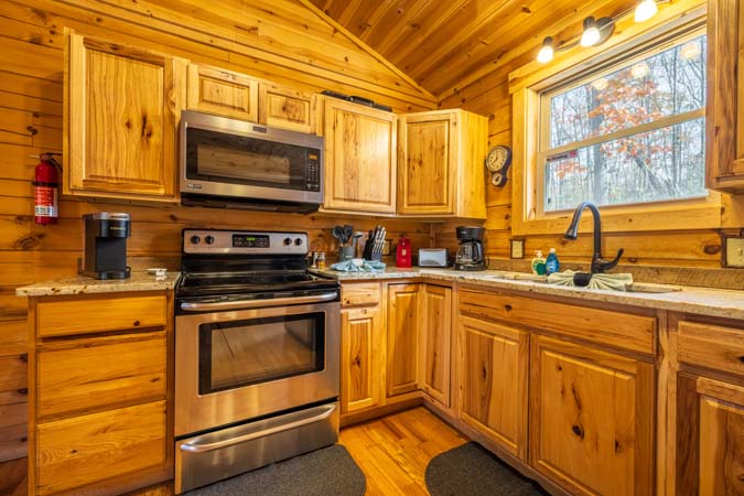 Outdoor fire ring with seating at Little Pine Cabin