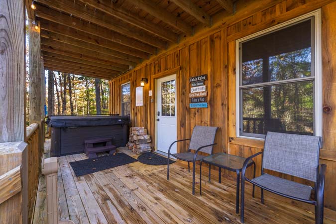 Upper deck with rocking chairs at Little Pine Cabin
