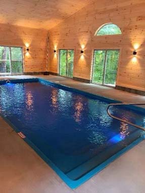 Relax, play, or exercise in the indoor saltwater pool in the detached pool house
