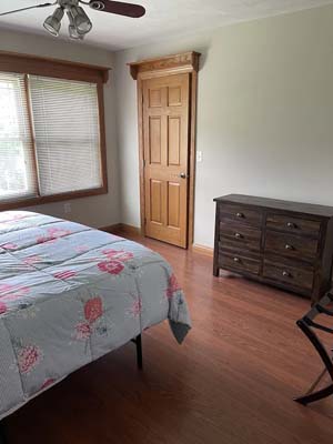 bedroom with dresser and ceiling fan
