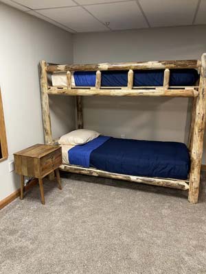 log bunk beds, blue bedding