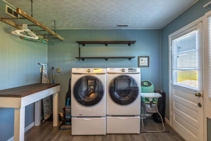 Ruby Farmhouse surrounded by open yard and countryside