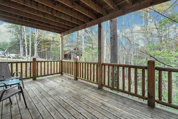 deck with wooded view